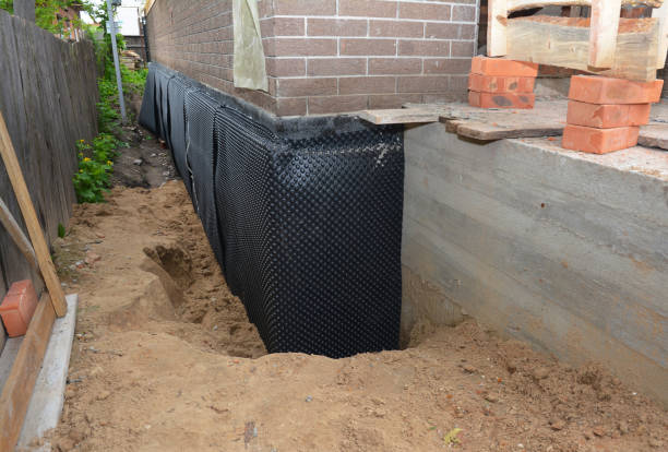 Happy homeowners after waterproofing job in Gilbertsville